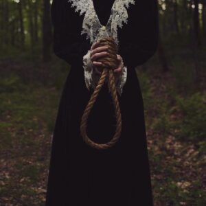 A person in black robe holding a rope A person in black robe holding a rope