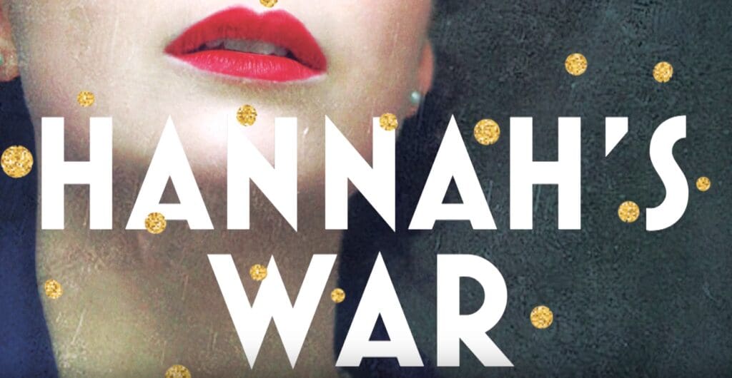 A woman with red lipstick and gold polka dots on her face.