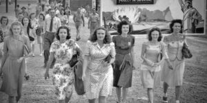 A group of women walking down the street.