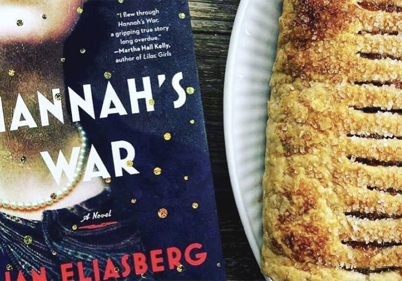 A book and food on top of a table.